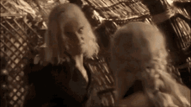 a man and a woman are standing next to each other .