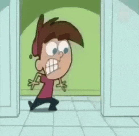 a cartoon character is standing in a doorway next to a man with a beard .