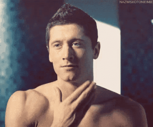 a man without a shirt has his hand on his chest and the words nazwiskotonieimie above him