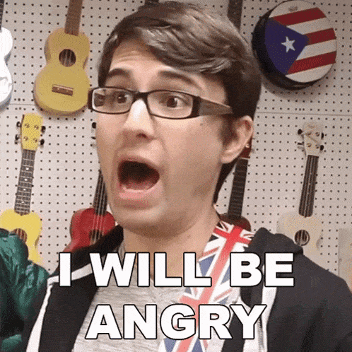 a man wearing glasses and a shirt that says i will be angry