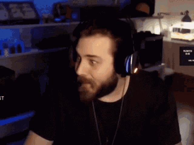 a man with a beard is wearing headphones with the word prompter on them