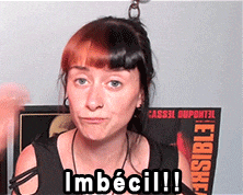 a woman says imbecil in front of a poster that says visible