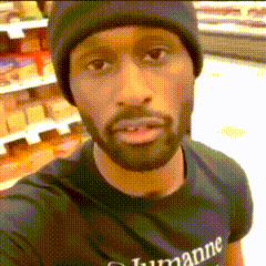 a man with a beard wearing a black t-shirt that says humane