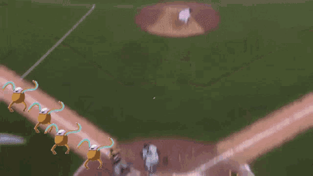 a baseball game is being played and the word quieto is above the field
