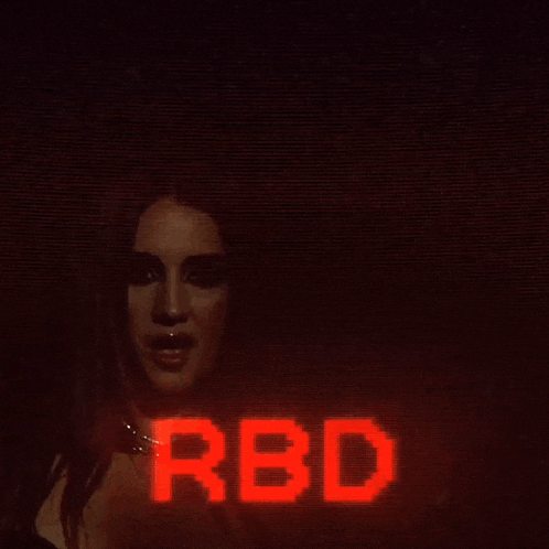 a close up of a woman 's face with the word red above her