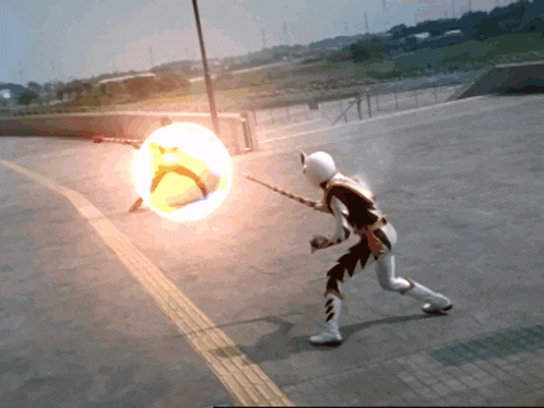 a man in a superhero costume is holding a sword and a shield