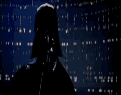 darth vader is standing in front of a wall with the words `` je suis ton pere '' written in white letters .