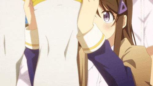 a girl with a purple triangle on her hair looks at something