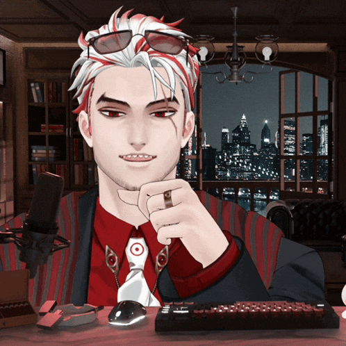 a man with red and white hair is sitting in front of a microphone and a keyboard