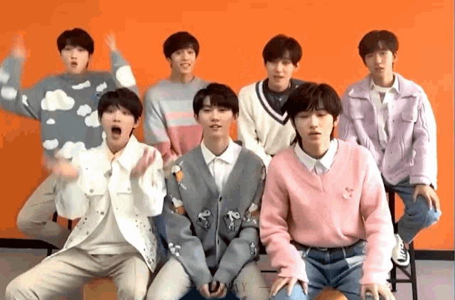 a group of young boys are posing for a picture together