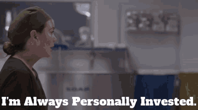 a woman in scrubs with the words i 'm always personally invested below her