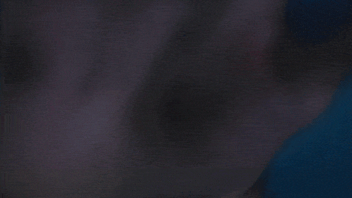 a close up of a person 's face with a dark background