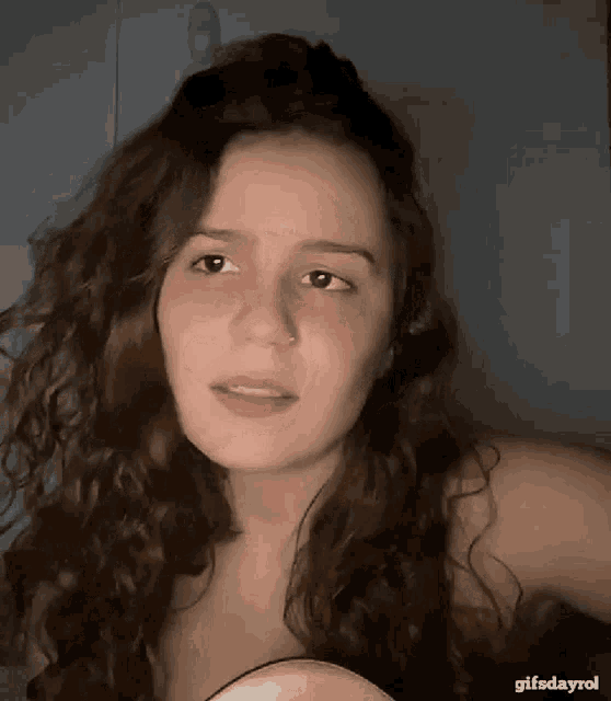 a close up of a woman 's face with the words gifsdayrol at the top