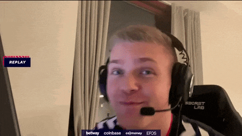 a man wearing headphones with a microphone and a replay button