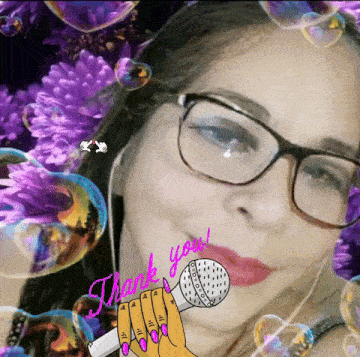 a woman wearing glasses is holding a microphone with the words thank you written on her face
