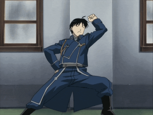 a man in a blue uniform with a fist in the air