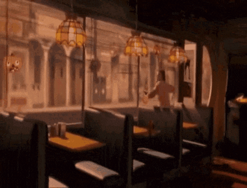 a diner with tables and booths and a man standing in the doorway