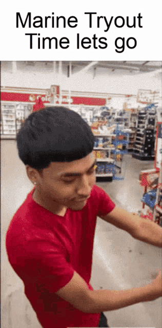 a man in a red shirt is standing in a store with the text marine tryout time lets go
