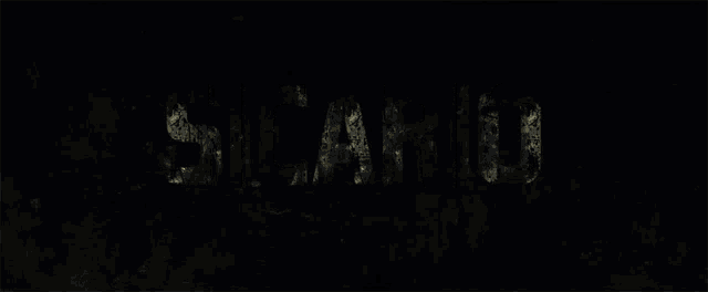 a black background with the word sicario in white