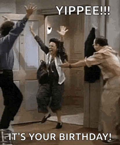 a woman is jumping in the air while a man and a woman are standing in front of a door .