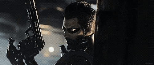 a man in a mask and sunglasses is holding a gun .