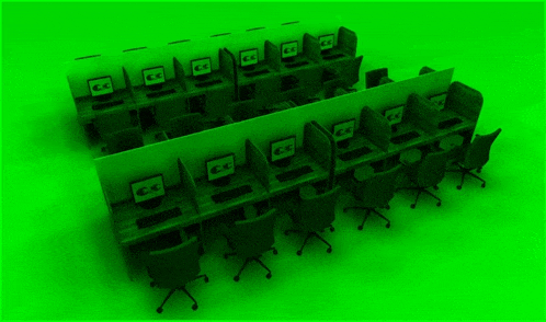 a row of computer cubicles with cc written on the screens