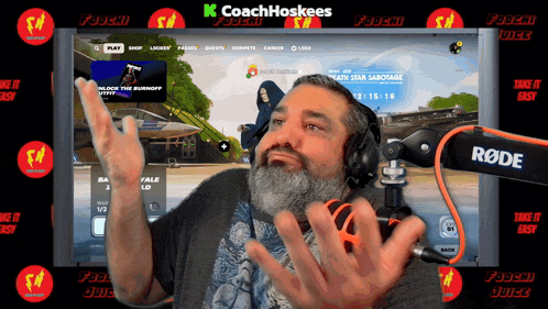 a man wearing headphones is playing a video game on a screen that says k coachhoskees