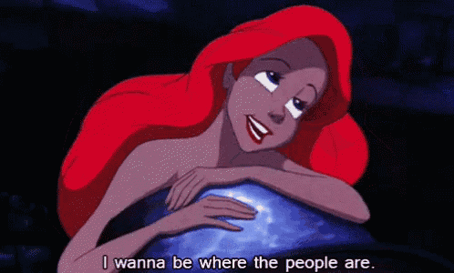 ariel from the little mermaid is laying on a rock and saying i wanna be where the people are .