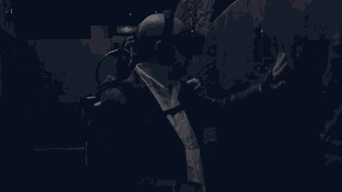 a man wearing an oculus virtual reality headset touches a wall