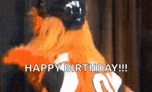 a person wearing an orange shirt with the number 20 on it says happy birthday .