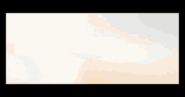a row of orange and white stripes on a black background .