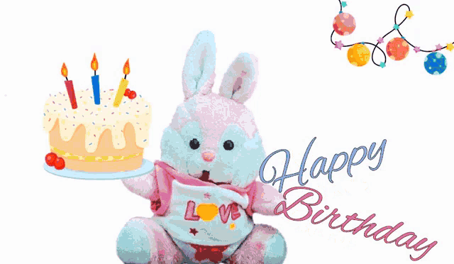 a stuffed bunny holding a cake with candles and the words health happiness and money