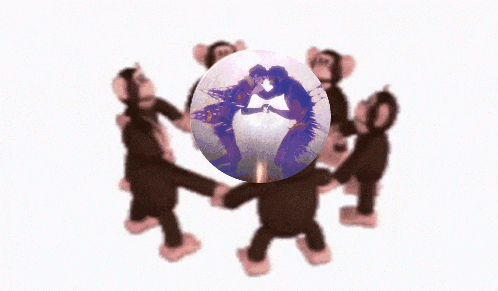 a group of monkeys dancing around a sphere with a picture of a couple kissing on it