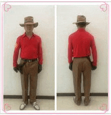 a man in a red shirt and brown pants is standing in front of a white wall .