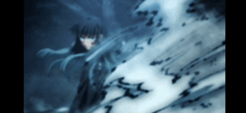 a blurred image of a person with long hair standing in the dark