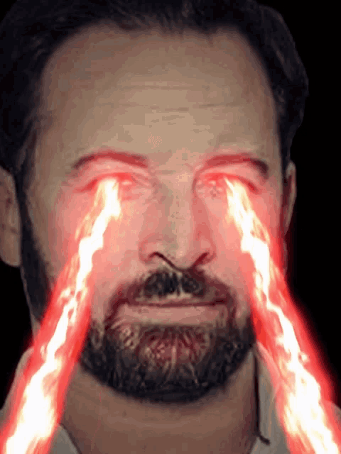 a man with a beard and glowing red eyes