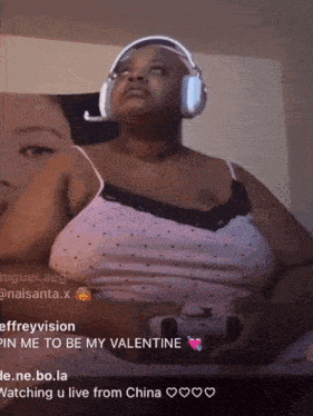 a woman wearing headphones and a tank top is watching a live from china