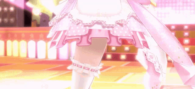 a girl in a pink dress and white knee high socks is standing on a stage