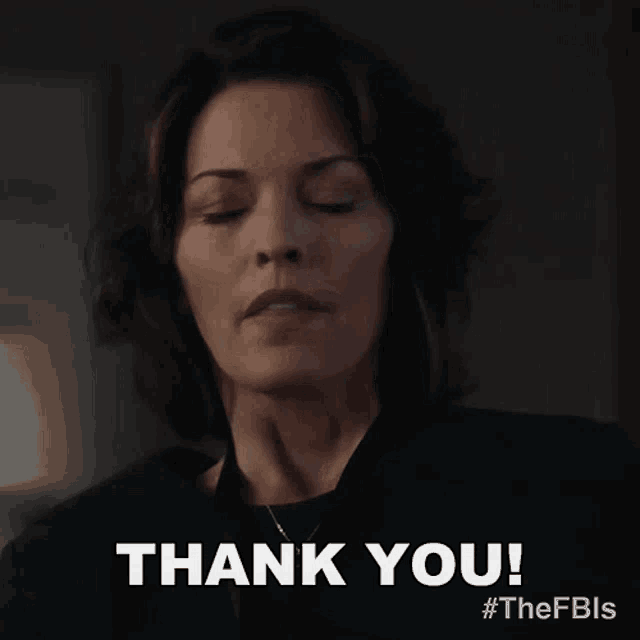 a woman with her eyes closed is giving a thank you sign