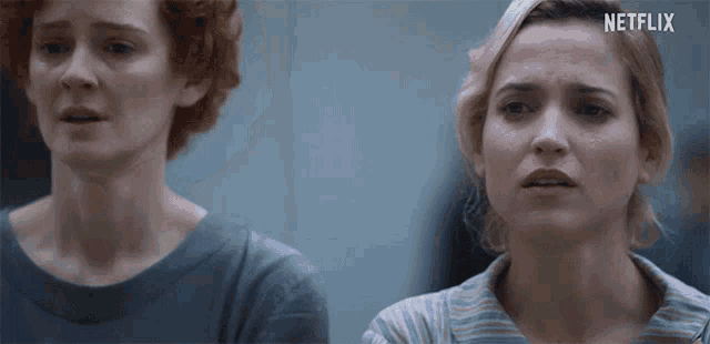 two women are standing next to each other with netflix written on the bottom