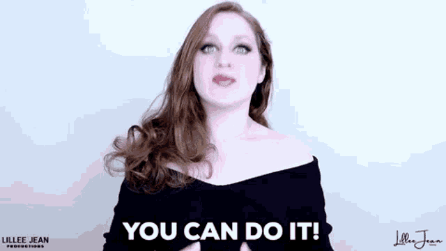 a woman is making a gesture with her hands and says `` you can do it '' .