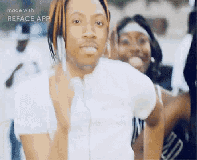 a man in a white shirt is standing in front of a group of people with the words made with reface app on the bottom right