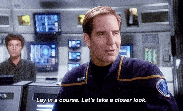 a man in a star trek uniform is saying " lay in a course let 's take a closer look "