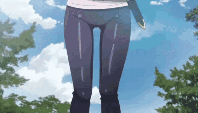 a close up of a person 's legs with a blue sky behind them
