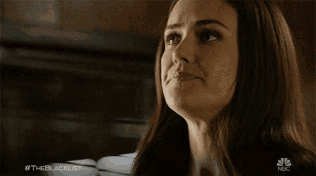 a close up of a woman 's face with the hashtag #theblacklist on the bottom