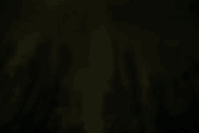 a dark background with a few lines of light coming through it