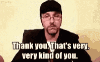 a man wearing glasses and a hat is saying `` thank you that 's very very kind of you '' .