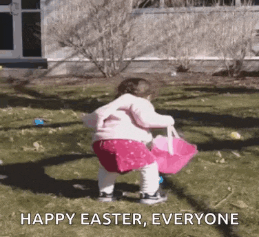 a little girl is holding a pink easter basket in a yard .