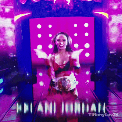 a woman in a red and black outfit is standing in front of a screen that says ' adriani ' on it
