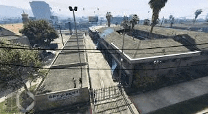 an aerial view of a building in a video game with a sign that says apartment rent .